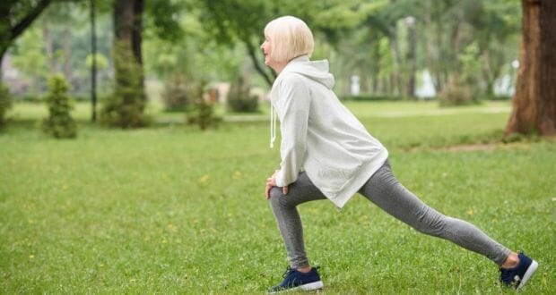lunges-elder woman doing forward lunge
