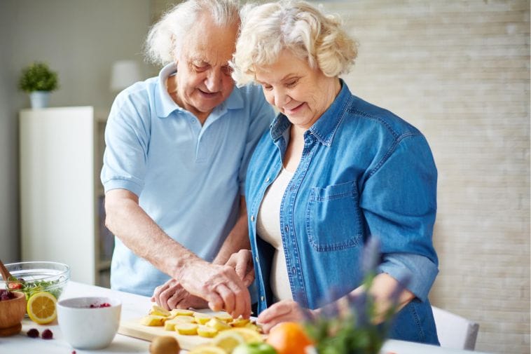 Senior couple preparing for a plant-based diet food Senior couple preparing for a plant-based diet food