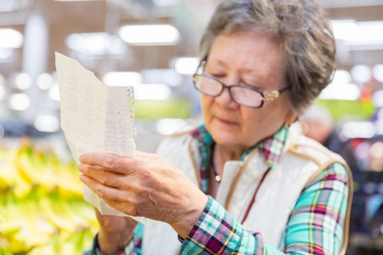 senior with grocery list senior with grocery list