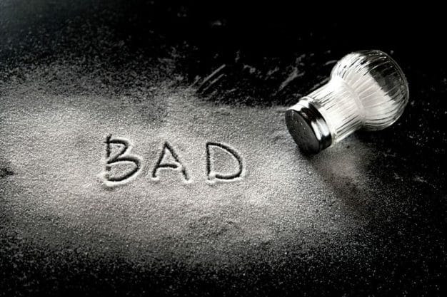 the word bad spelled out in salt the word bad spelled out in salt
