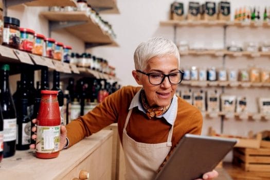 old woman checking the food label