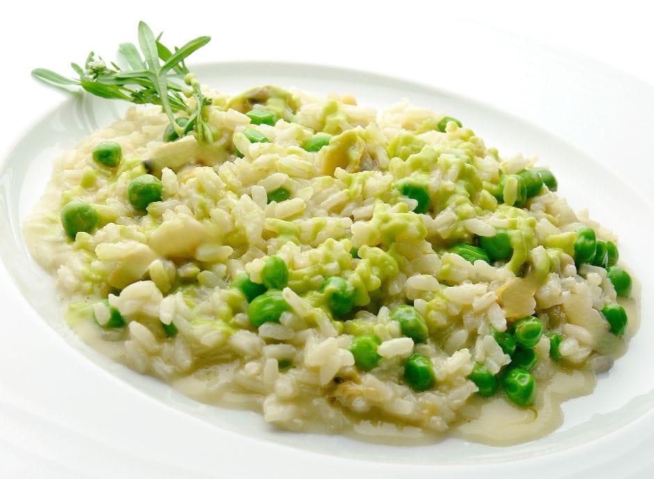 Risotto with peas and sprigs of thyme.