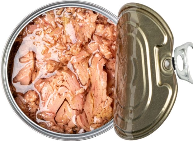 A can of tuna with meat in it on a white background.