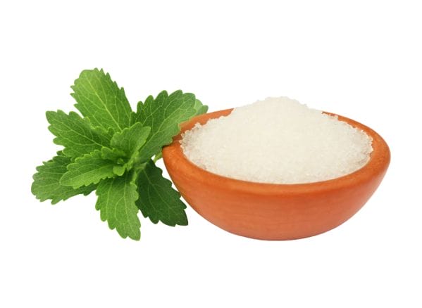         A bowl of sugar and a mint leaf on a white background.