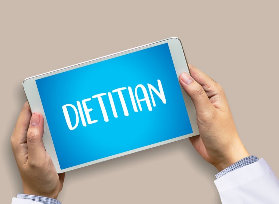 A person holding a tablet with the word dietan on it.