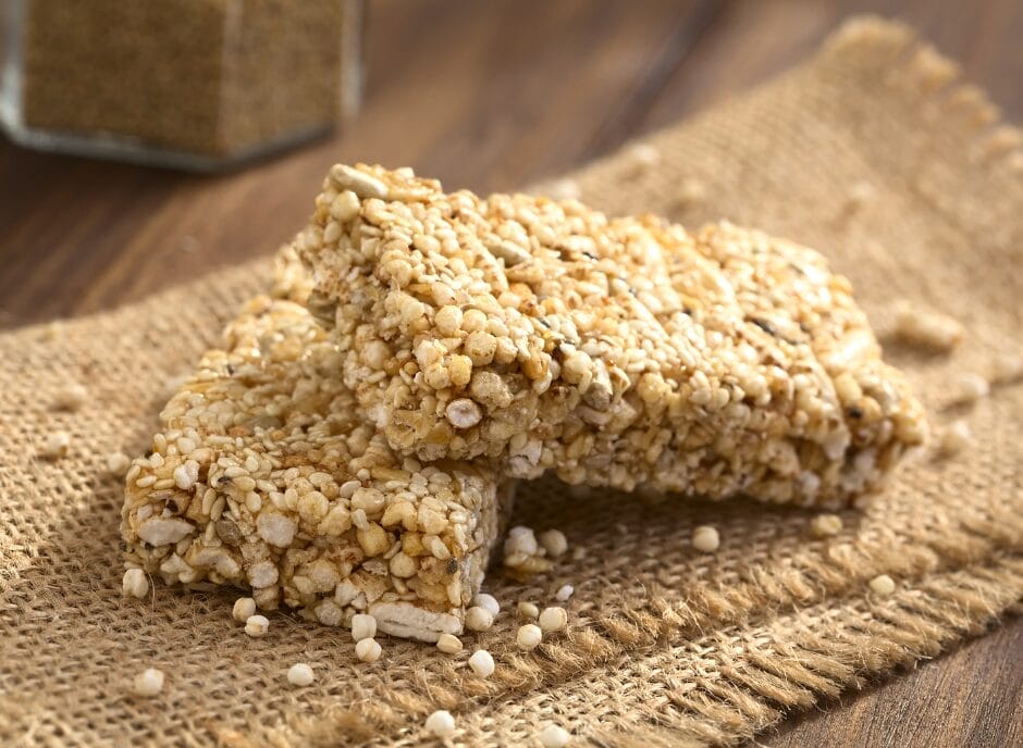 Sesame granola bars on a wooden table.